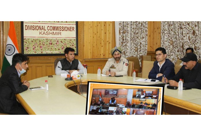 Div Com Kashmir chairing a meeting on Monday.