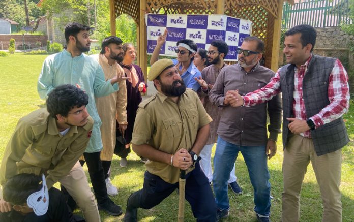 A scene from the play ‘Girgit’ staged at Mughal Garden, Verinag in Anantnag.