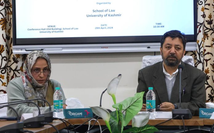 Prof Mohammad Hussain, Dean and Head of the School of Law, KU addressing during a programme in Srinagar on Tuesday.