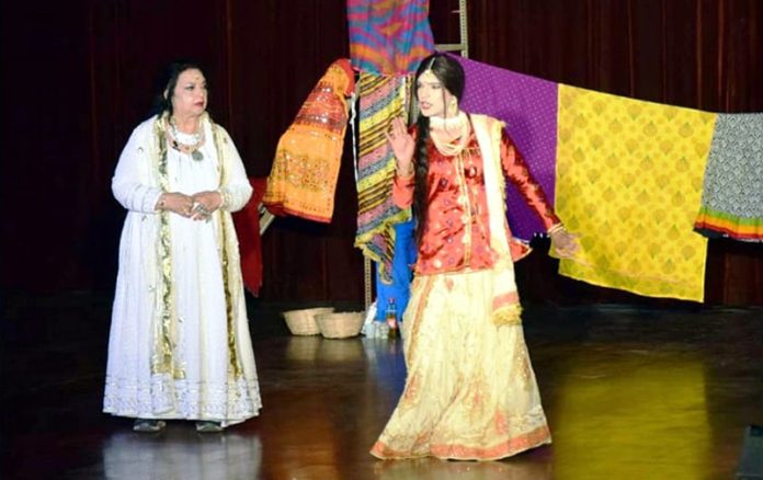 Artists performing their role during a play staged in Jammu on Sunday.