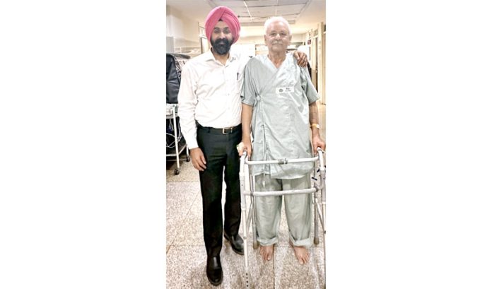 Dr Ranjit Singh posing with a patient on whom he performed knee replacement.