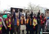 Leaders of Shiv Sena posing with new entrants at a function in Pulwama.