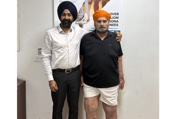 Dr Ranjit Singh posing with a patient on whom he performed revision knee replacement surgery.