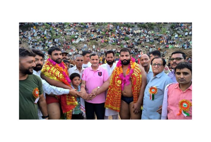 Wrestlers being introduced before the main bout by the chief guest in Reasi on Sunday.