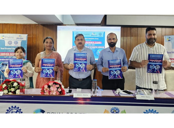 DSEJ and others releasing a booklet during inaugural of the Summer Science Camp at IIIM.