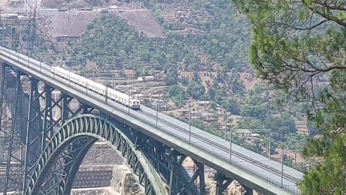 Trial run of train over highest Railway bridge on Chenab in Reasi on Thursday. -Excelsior/Romesh Mengi
