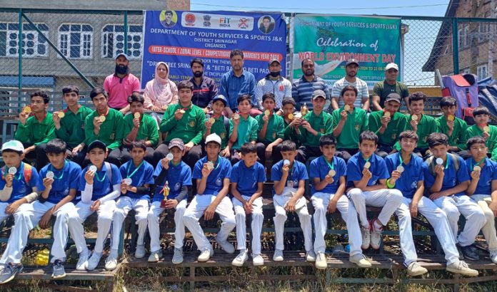 Budding cricketers posing along with medals on Tuesday.