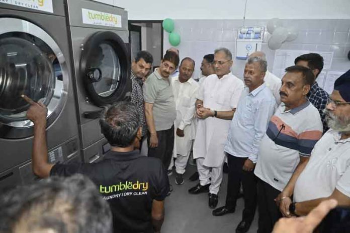 Former DyCM, Kavinder Gupta inaugurating Dry Clean and Laundry service at Janipur on Sunday.