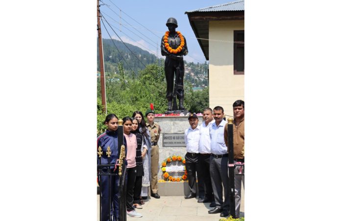 NCC cadets, officials posing along with the bust of soldier Chunni Lal at Bhaderwah.