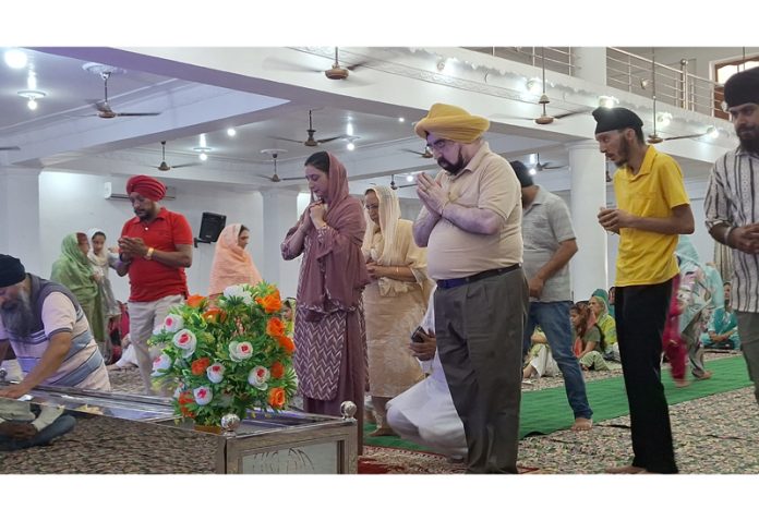 Devotees offering prayers during Shaheedi Diwas at Kathua on Sunday.