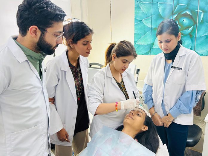 Dr Parul Verma demonstrating facial aesthetic procedure to new dentists during a workshop at Ivy Clinic, Gandhi Nagar, Jammu.