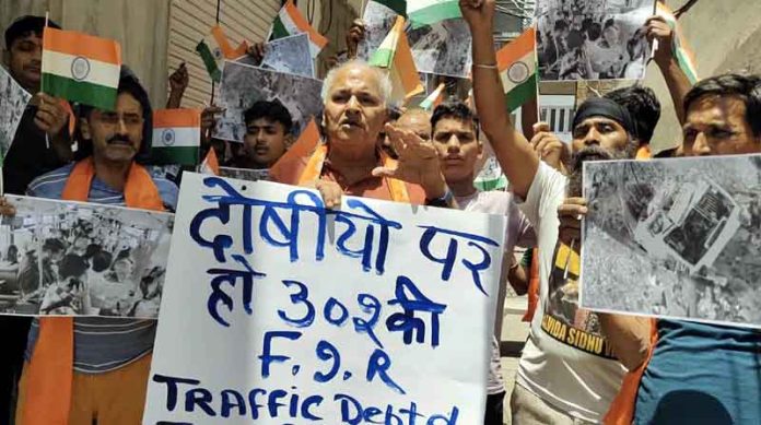 DF&SS workers raising slogans during a protest rally in Jammu on Saturday.