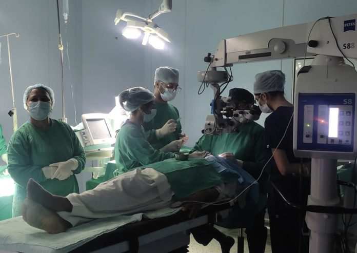 A team of doctors and technicians conducting cornea transplant on a patient at GMC Jammu.