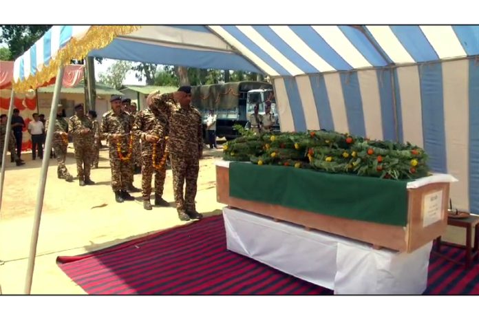 CRPF and Police officers laying wreaths at CRPF Jawan martyred in encounter at Hiranagar on Wednesday.