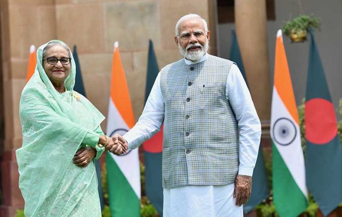 Prime Minister Narendra Modi with Bangladesh Prime Minister Sheikh Hasina before the delegation level talks at Hyderabad House, in New Delhi on Saturday. (UNI)