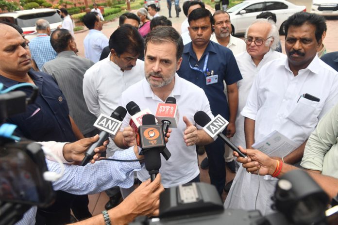 Leader of Opposition in Lok Sabha Rahul Gandhi talking to newsmen on NEET issue at Vijay Chowk, outside the Parliament House in New Delhi on Friday. (UNI)