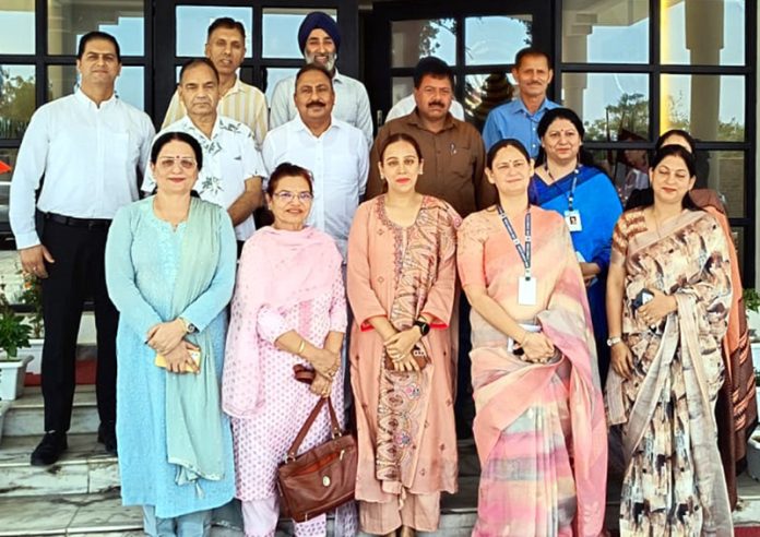 School Management Committee members posing during the meeting.