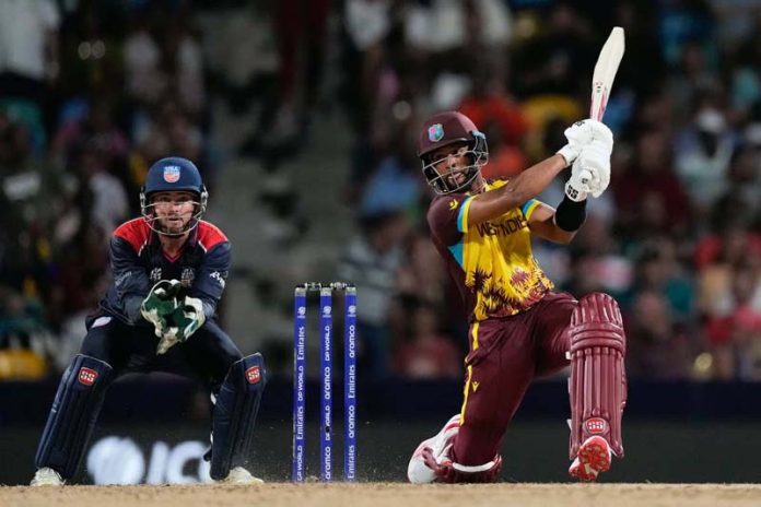 West Indies' Shai Hope hits a six during his 82 runs not out inning against USA at Barbados.
