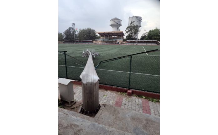 A high-mast light pole installed at Mini Stadium, Parade Jammu collapsed due to windstorm.