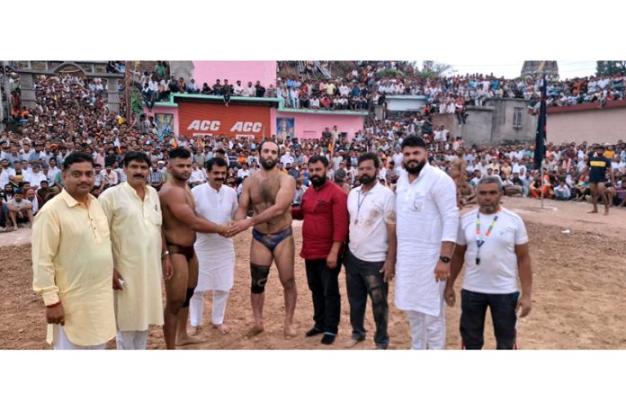 Dignitaries posing along with wrestlers before a bout at Ramkote on Thursday.