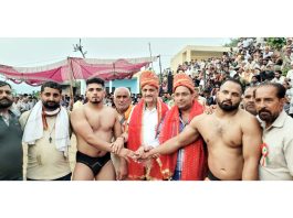 Wrestlers being introduced by dignitaries before the bout at Reasi.