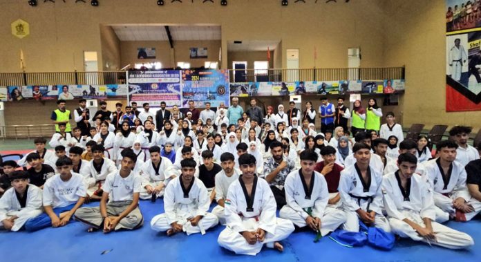 Taekwondo players posing along with dignitaries during concluding ceremony at Srinagar.