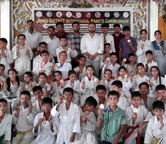 Karatekas posing along with dignitaries during prize distribution ceremony at Jammu.