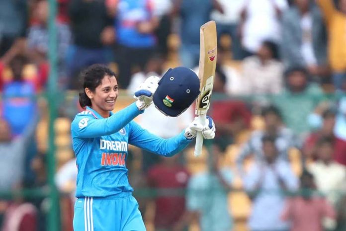 Smriti Mandhana raising her bat after scoring 136 runs against South Africa at Bengaluru on Wednesday.