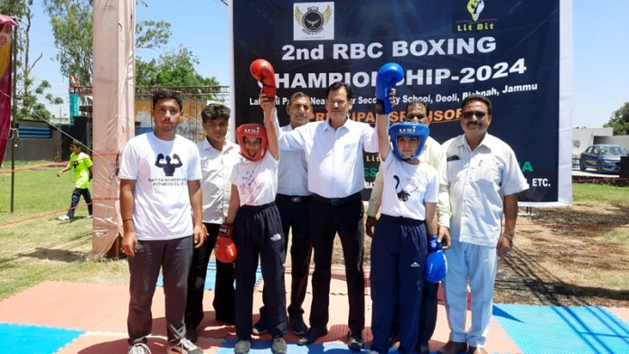 F C Bhagat posing along with young boxers at Bishnah.