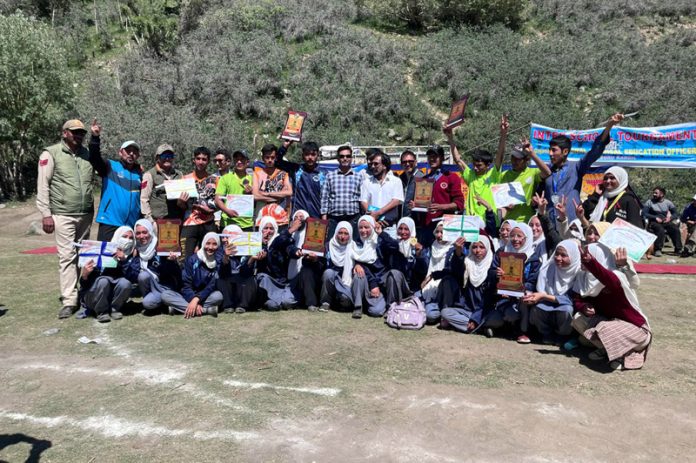 Young athletes posing along with dignitaries during Inter-School tournament at Kargil.