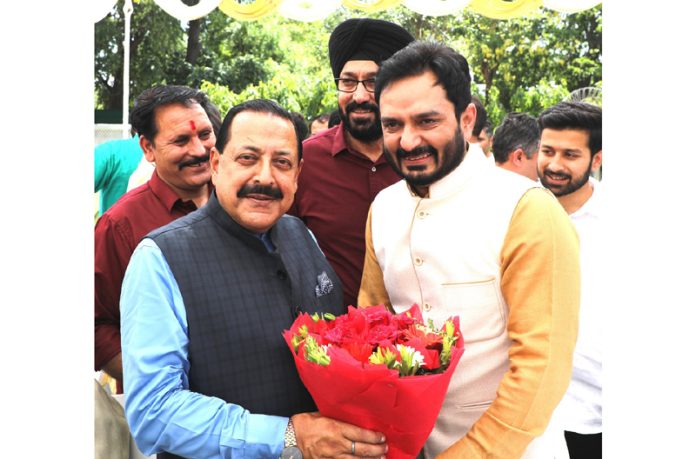 BJP senior leader Abhijeet Jasrotia presenting a bouquet to Union Minister Dr Jitendra Singh at New Delhi.