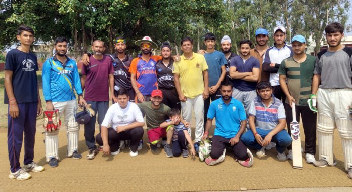 Winning team posing during a cricket tournament at Akhnoor on Friday.