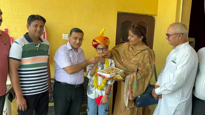 Anjali Sharma a student of Martyr Major Rohit Verma Memorial Hr. Sec. School, Ghagwal has brought glory to her school as well as her parents and the whole of Jammu and Kashmir by securing 10th position in science stream in class 12th results declared yesterday.