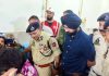 ADGP Jammu Anand Jain interacting with an injured cop at GMC Doda on Thursday.