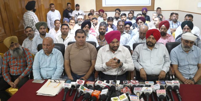 AJKTWA Chairman Ajit Singh and other Transport Union heads addressing joint press conference in Jammu. -Excelsior/Rakesh