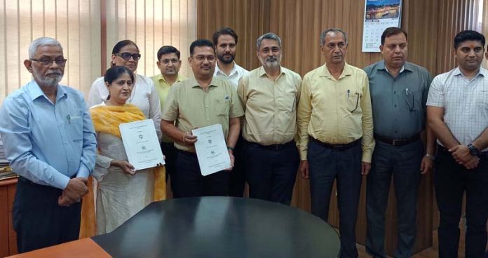 Director JKEDI with Vice-Chancellor of Cluster University Jammu and others at the signing of MoU.