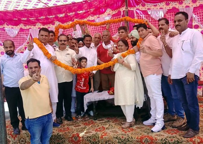 BJP president Ravinder Raina and former Minister Sukhnandan Choudhary during a rally at Marh on Wednesday.