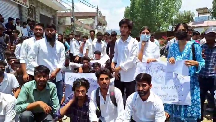College students protesting against new guidelines for admission in 5th semester.