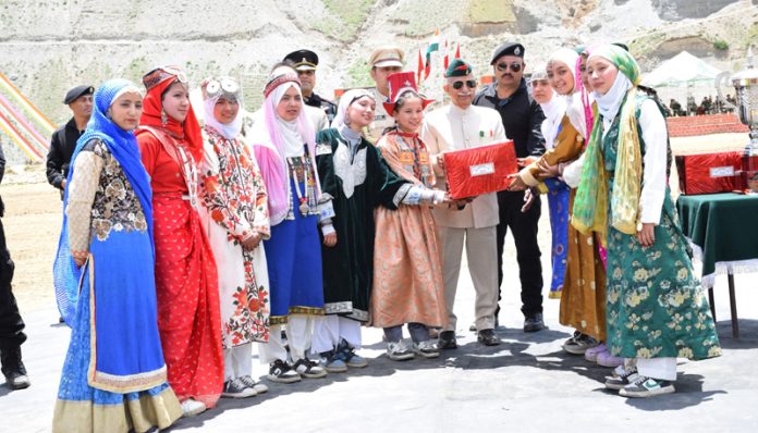 LG Ladakh, Brig (Dr) B D Mishra felicitating the participants of the Summer Carnival in Dras on Monday.