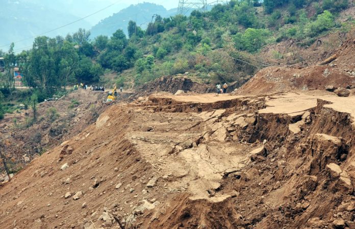 A view of area hit by land sinking at Parnote in Ramban.