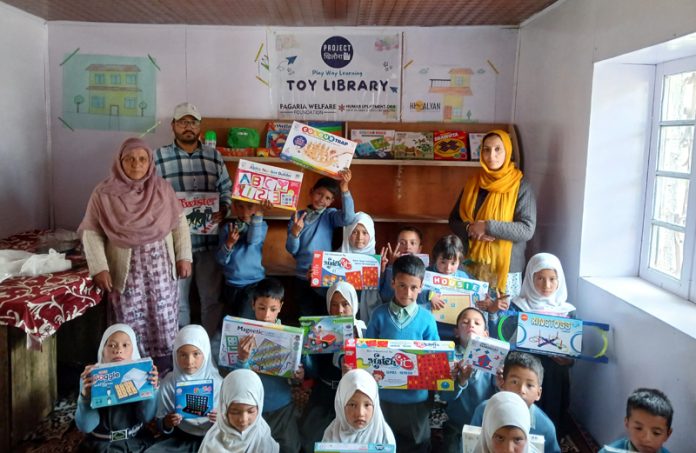 Students posing along with toy sets at Govt School Drass.