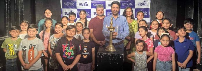 Natrang Director, Balwant Thakur along with children and others at the start of a theatre workshop in Jammu on Monday.