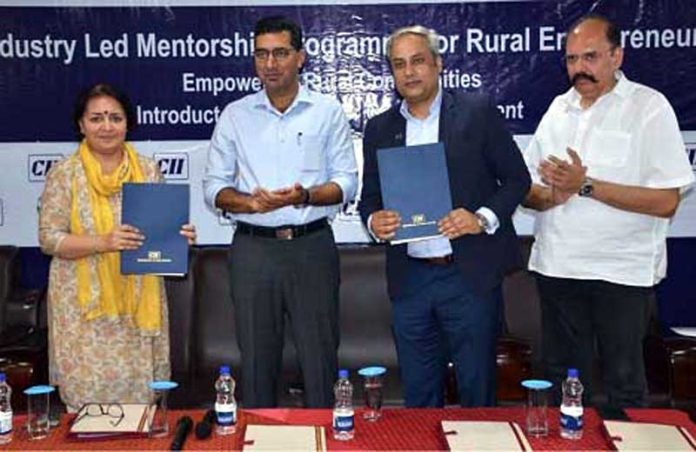 Dignitaries during signing of MoU between JKRLM and CII on Wednesday.