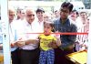 SMVD Shrine Board's CEO Anshul Garg and Member Dr Ashok Bhan facilitating a little girl to cut the ribbon during inaugural of Plant Sale Counter.