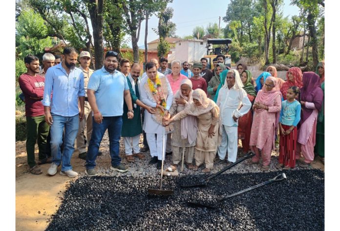 Colonel Mahan Singh (Retd.) inaugurating black topping work of a road in Basholi on Tuesday.
