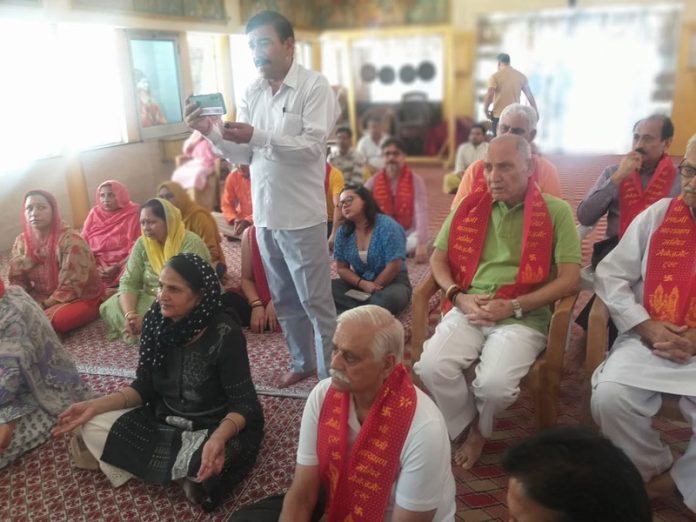 Devotees during a meditation workshop at a temple in Gandhi Nagar, Jammu on Tuesday.