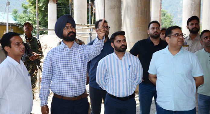 DC Harvinder Singh inspecting multi car parking facility in New Bus Stand Doda on Thursday.