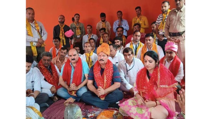 Chairperson DDC Udhampur Lal Chand, DC Udhampur Saloni Rai and others attending Puja at inaugural of Sudhmahadev Mela on Friday.