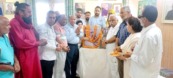 National Conference leaders paying tribute to Afzal Beg and Mohi-ud-Din Shah in Jammu on Tuesday.