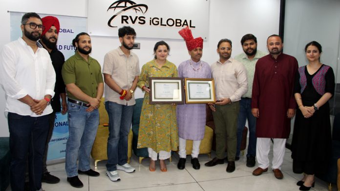 Sandeep Sharma, COO of RVS iGlobal along with others felicitating during a function in Jammu on Friday. -Excelsior/Rakesh